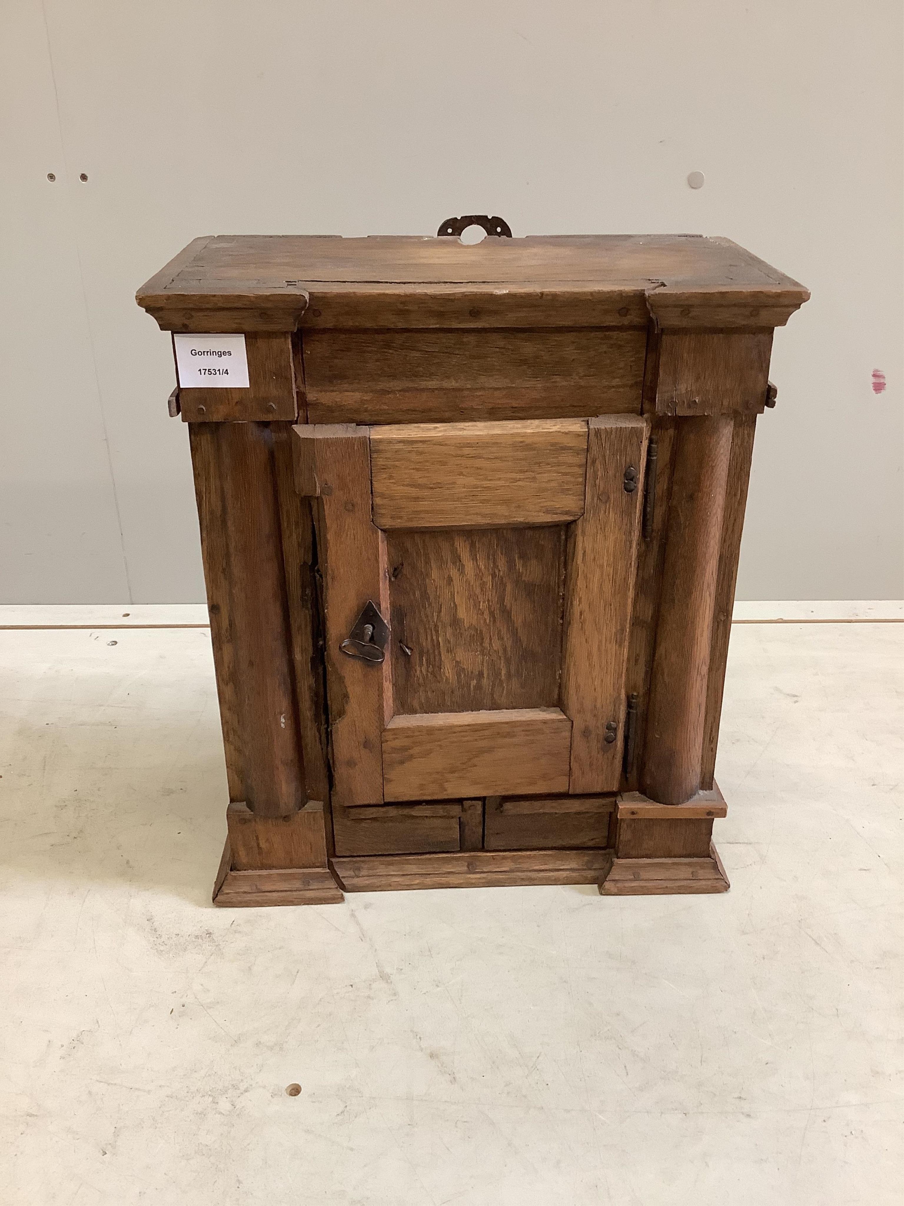 A small oak cupboard, width 38cm, depth 20cm, height 45cm